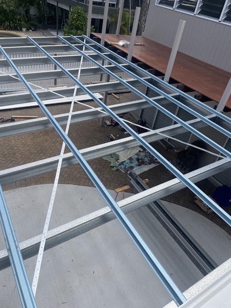 Deck framing with joists set out in a grid before the boards go down